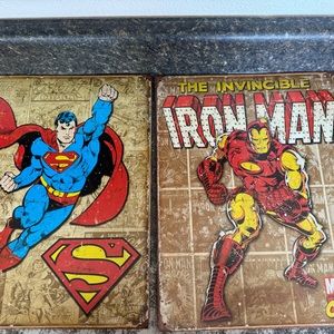 Superman and Iron man tin signs.